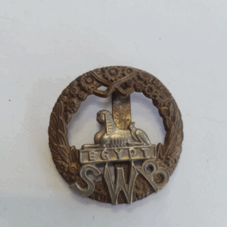 Genuine South Wales Borderers cap badge with slider bi-metal