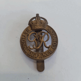 Original National defence company cap badge kings crown